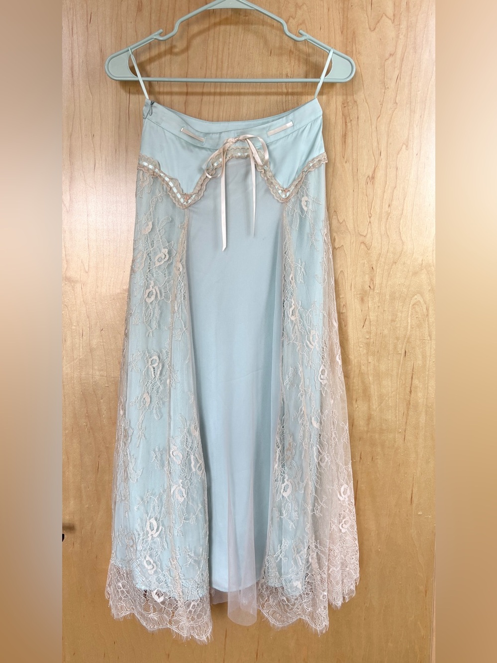 Lacemade light blue lace overlay skirt with ribbon detail. Never worn